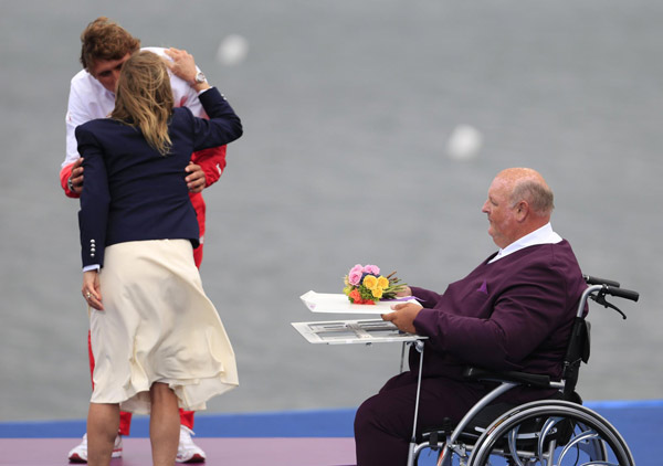 A very special medal and flower bearer