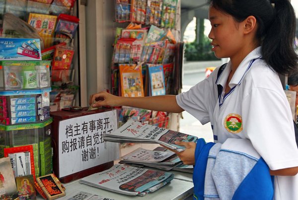 Self-service vegetable and newspaper stands in China