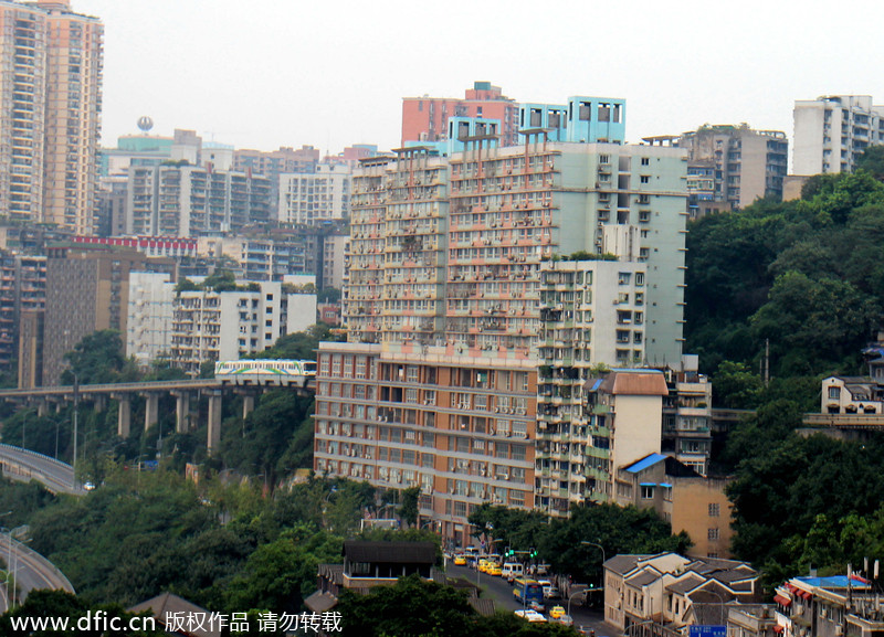 Light rail pass through building in Chongqing