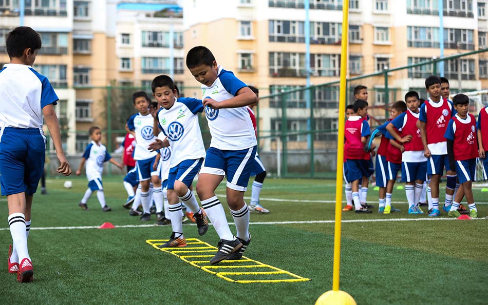 VW helps train young football stars in China