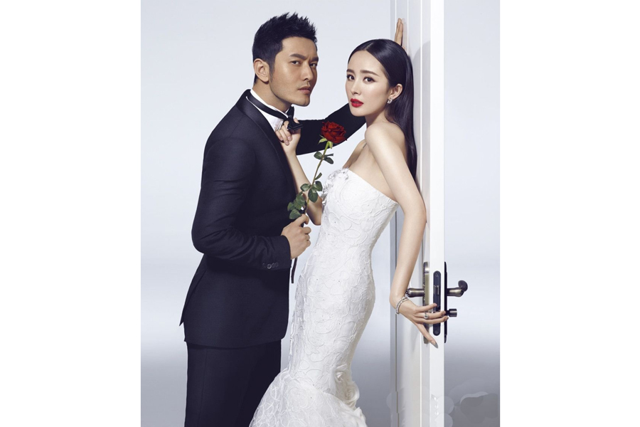 Huang Xiaoming and Yang Mi pose for fashion magazine