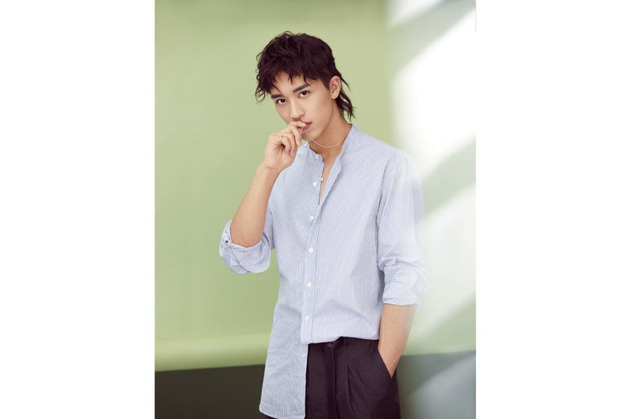 Actor Xu Weizhou poses for fashion magazine