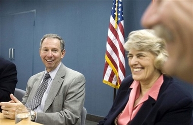 NASA administrator Michael Griffin, left, NASA astronaut Shannon Lucid share a light moment during a roundtable talk with reporters at the U.S. Embassy press center in Beijing Monday, Sept. 25, 2006. Griffin was in Beijing on Monday for talks with Chinese officials that China's government hopes will lead to cooperation in space exploration. (AP