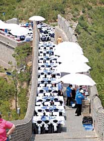 Activities that cause damage to the Great Wall, such as skateboarding, dining and erecting electricity poles as shown above, could be deemed illegal from December 1, according to a new set of national rules.