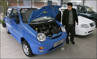 A customer looks at the engine of a Chery QQ car at a dealership of China's largest car exporter, Chery Automobile in Shanghai. China plans stricter export rules to ensure that only big and credible auto makers take part in the nation's push to become a major power in the global vehicle market, state media said.(AFP