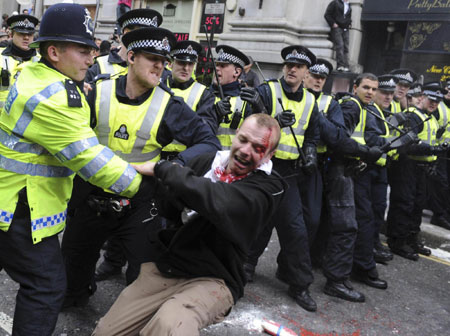 London police charge to disperse G20 protesters