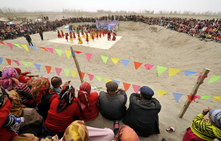 Uygurs perform traditional dancing