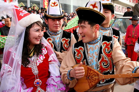 Uygurs perform traditional dancing