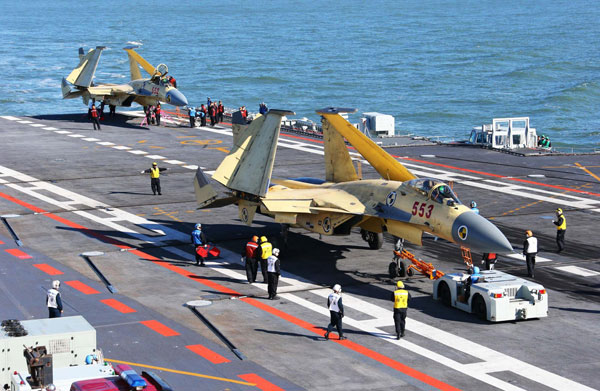 Jets land on China's 1st aircraft carrier