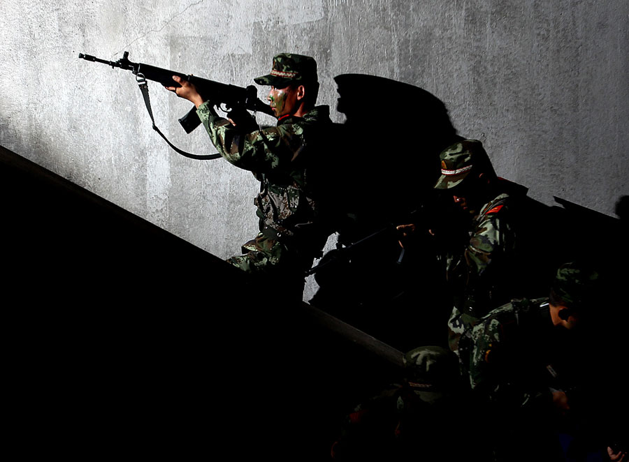 Armed policemen conduct combat exercises in Shanghai