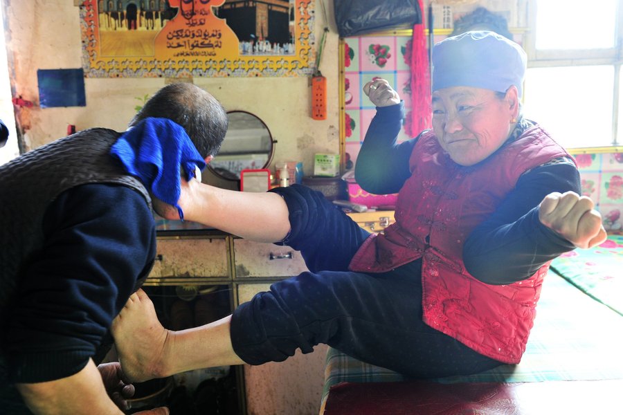 Disabled woman uses her feet to care for husband