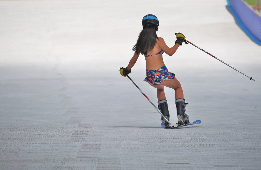 Models in bikinis turn ski resort hot