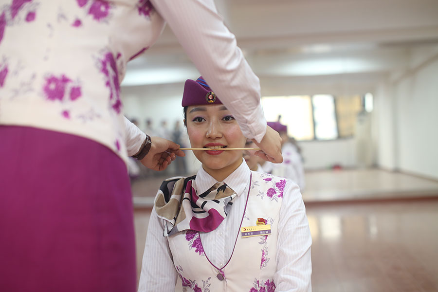 Stewardesses trained to show sweet smile