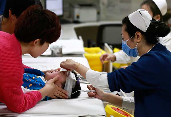 Thousands of kids fall ill with flu in Beijing