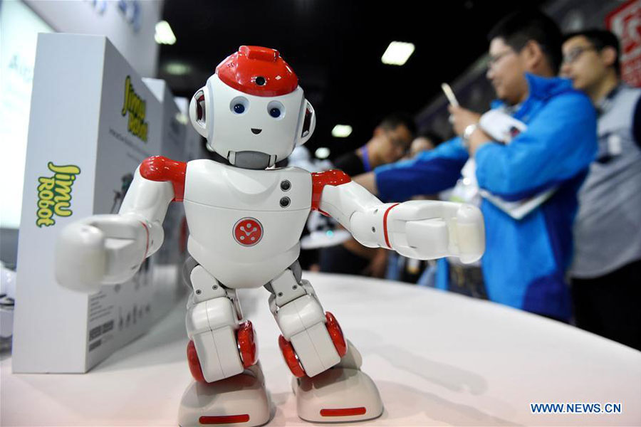 Robots dance, fight fire and serve meal at Henan expo