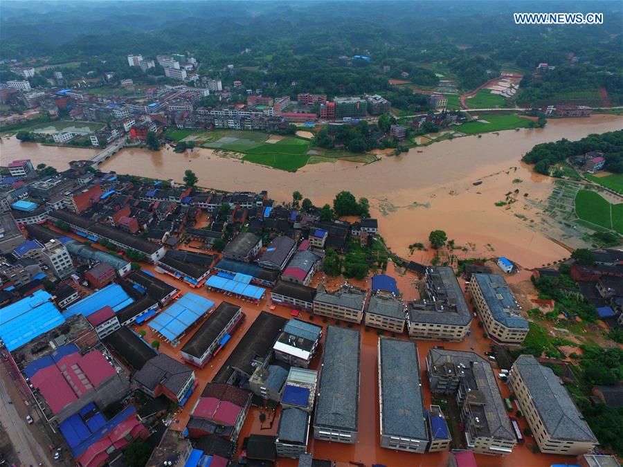 13 dead, 13 missing in China rain, landslides