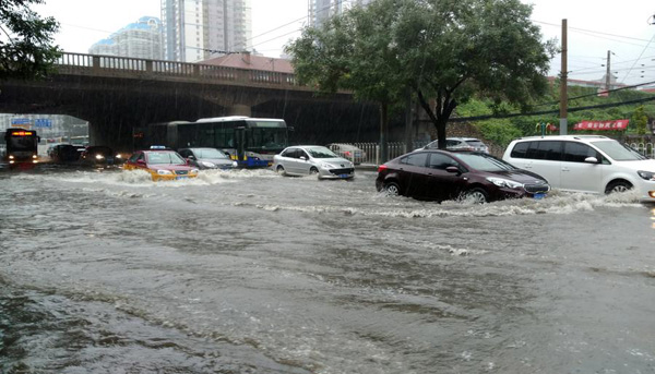 Beijing issues orange alert for heavy rain, train, flights delayed