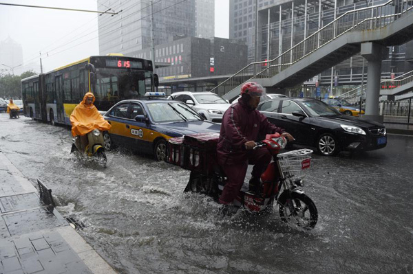 Beijing issues orange alert for heavy rain, train, flights delayed