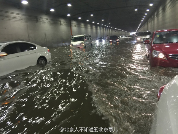 Beijing issues orange alert for heavy rain, train, flights delayed