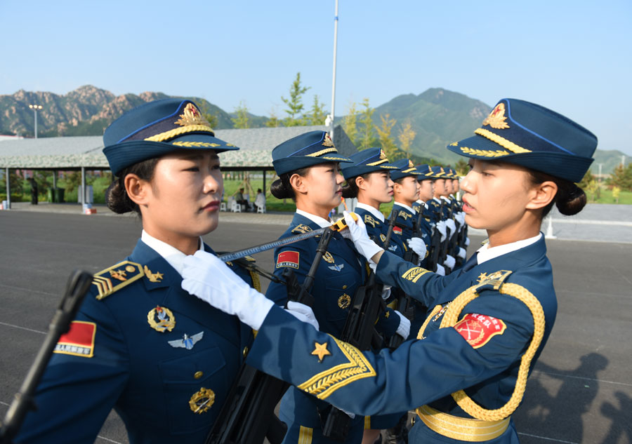 Marching with honor: Women soldier carrying the flag