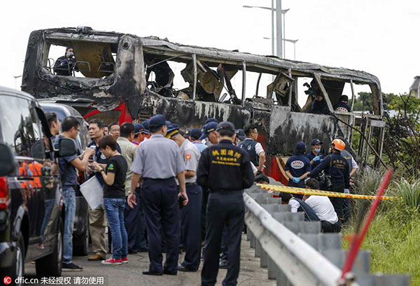 26 die after tour bus catches fire on highway in Taiwan