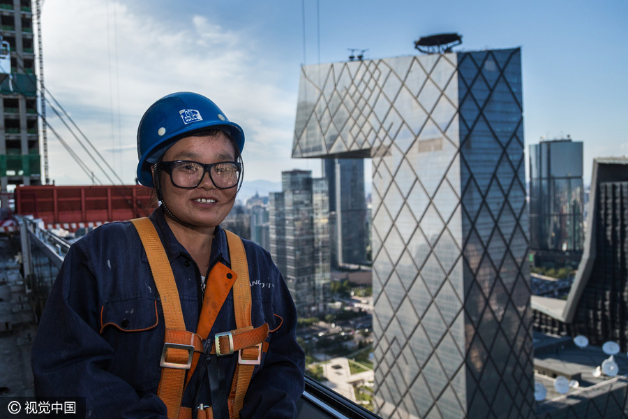 Workers behind Beijing's tallest building