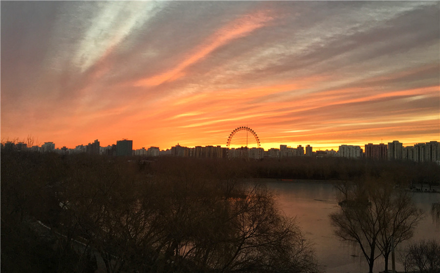 Beijing wakes to rosy dawn