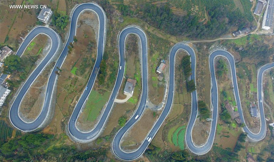 Winding road looks like jade belt around mountain in Central China