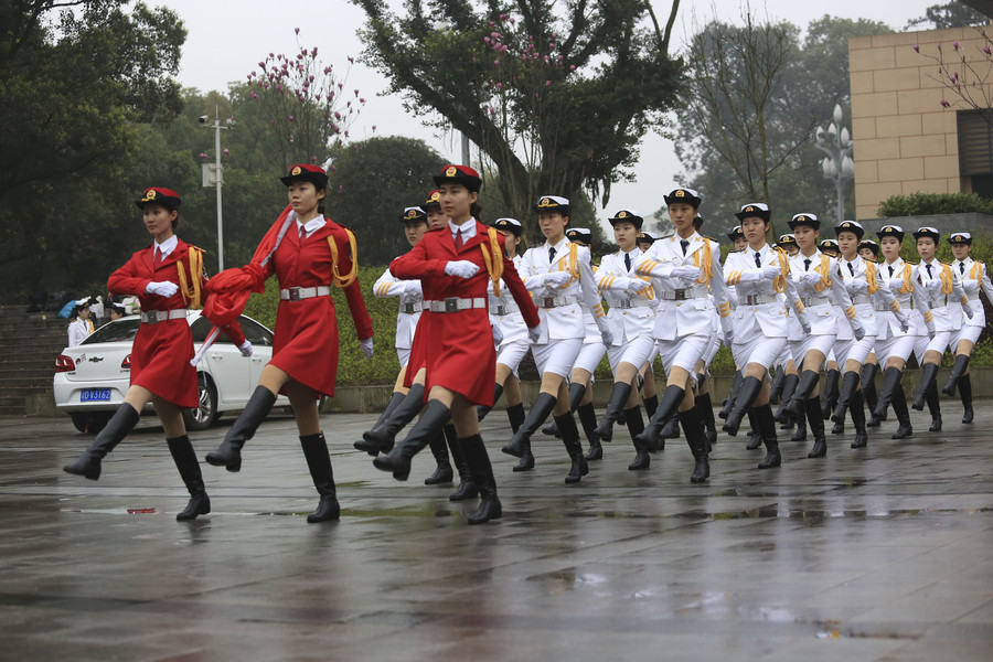 Marching in step: Female college students form flag-raising team