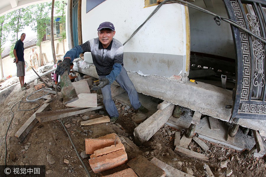 Four-story building moved 10 meters for railway line