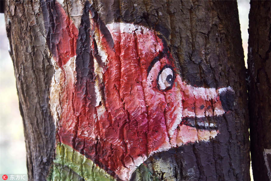 Paintings bring tree trunks to life