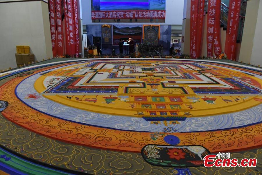 Sand mandala, 6.5 meters in diameter, on show in Dunhuang