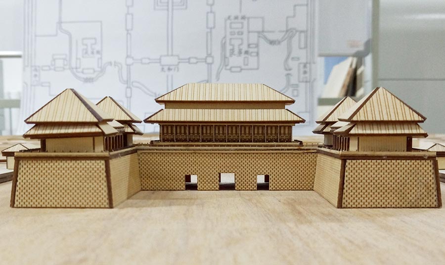 College students miniature Palace Museum on a wooden board