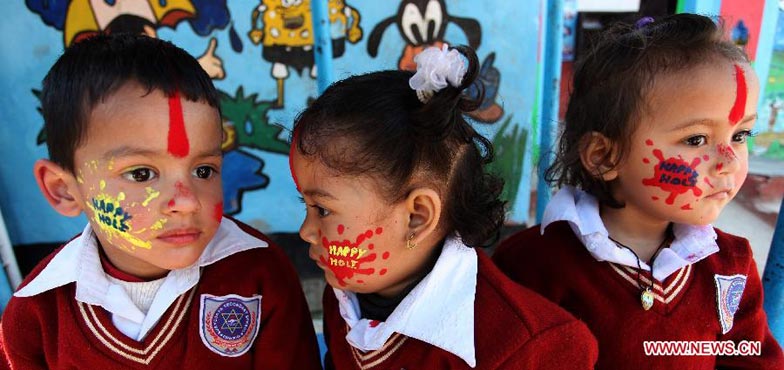 Children celebrate Holi festival in Kathmandu