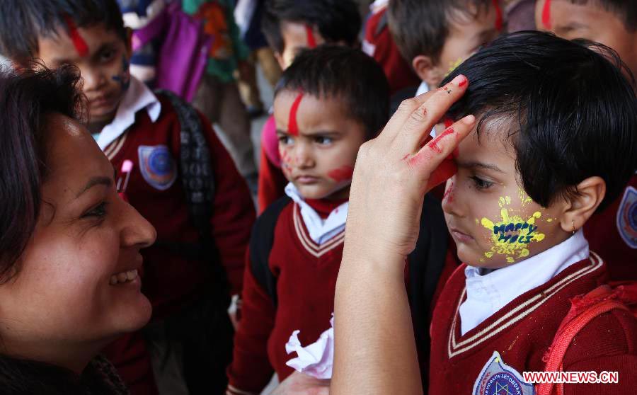 Children celebrate Holi festival in Kathmandu