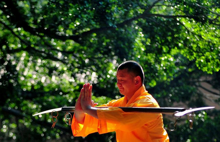 Monks practice martial art at Quanzhou Shaolin Temple