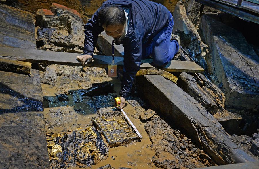 Gold coins, hoofs found in 2,000-year-old Chinese tomb