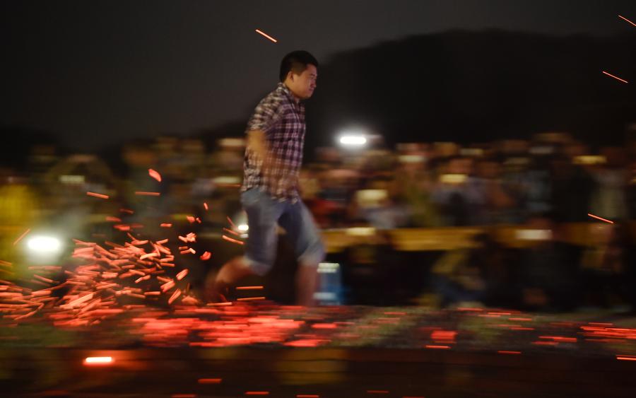 Stunt 'climbing on blades' performs in China's Fujian province