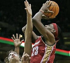 Cleveland Cavaliers' LeBron James (23) puts up a shot with Milwaukee Bucks' Andrew Bogut defending during the first quarter Saturday, Dec. 10, 2005, in Milwaukee.