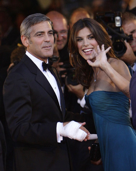 George Clooney and his girlfriend on red carpet at 66th Venice Film Festival