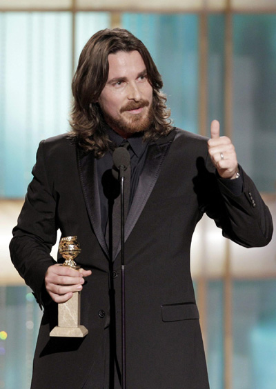 Christian Bale holds his award for best supporting actor for 'The Fighter'