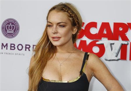 Lindsay Lohan says she's an addict, aims 'to shut up and listen'