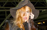 Lindsay Lohan says she's an addict, aims 'to shut up and listen'