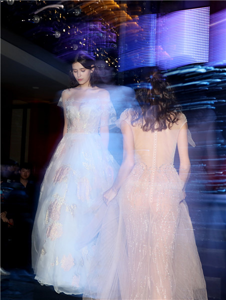 Models present creations at W Beijing's fashion wedding show