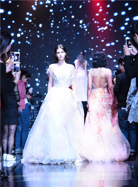 Models present creations at W Beijing's fashion wedding show