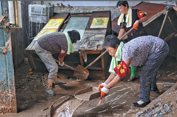 Four officials suspended after fatal floods