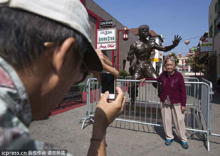 Bronze statue of kung fu star Bruce Lee on display in LA