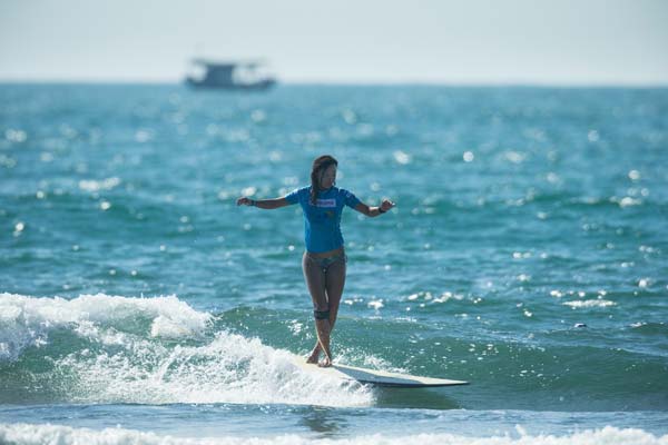 Female surfer rides China's waves