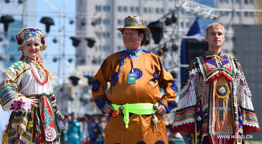 Models present costumes in China's Inner Mongolia