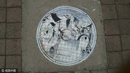 Students turn manhole covers into works of art